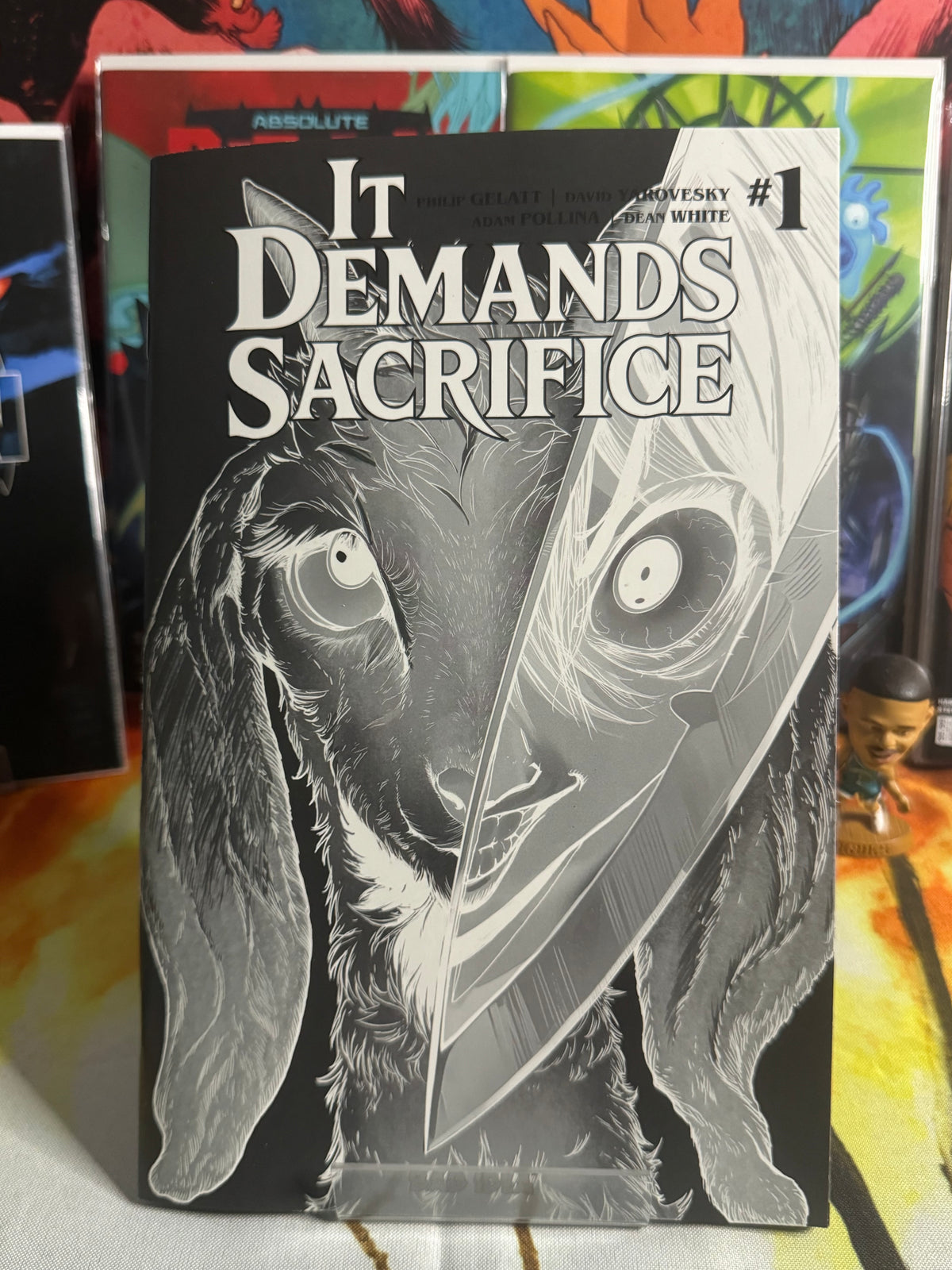 IT DEMANDS SACRIFICE #1 (OF 4) CVR J GLOW IN THE DARK VARIANT